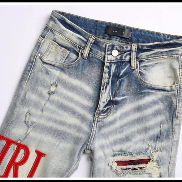 Jeans slim déchiré brodé