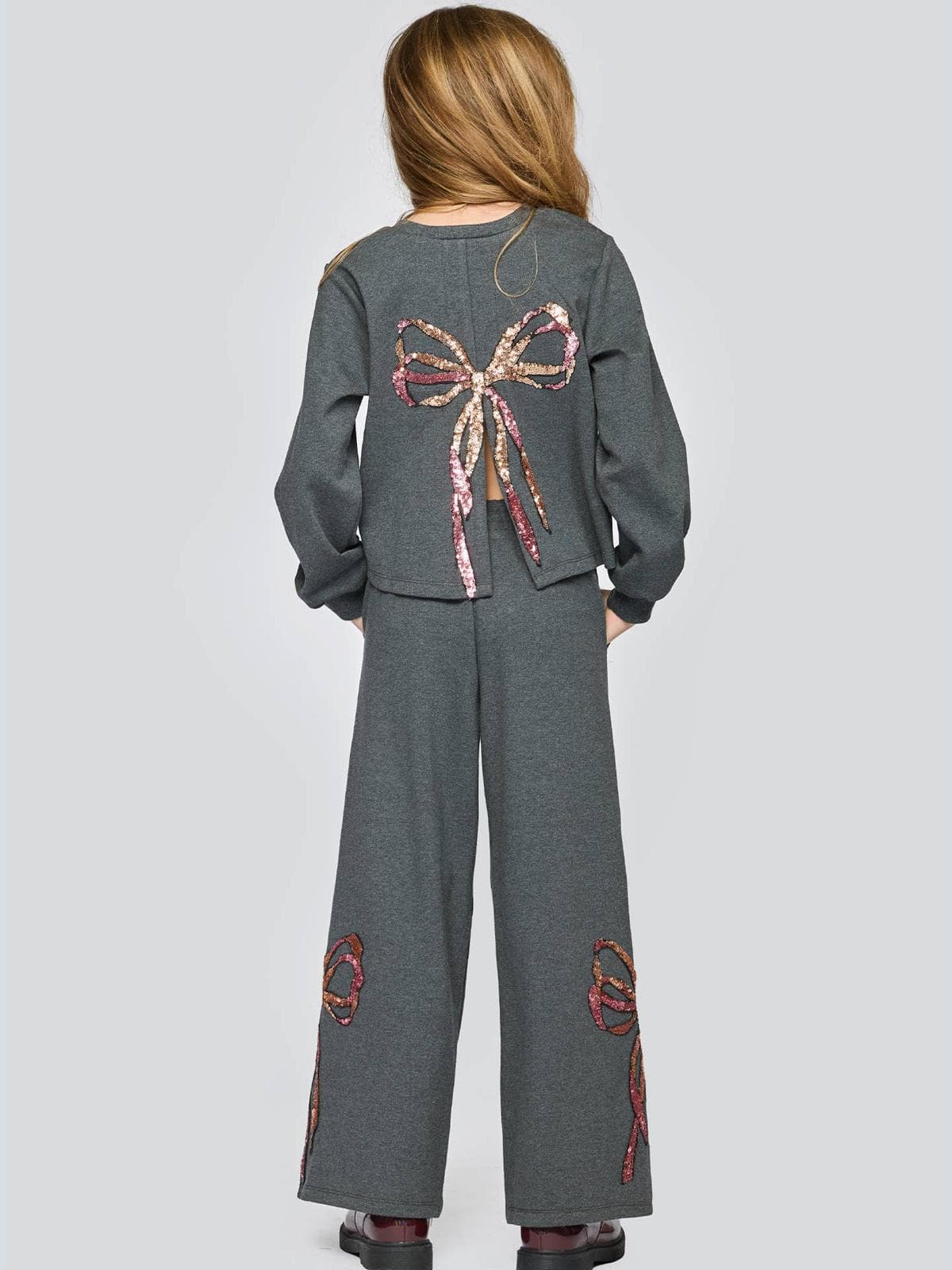 Sweat-shirt à nœud en sequins avec fente au dos