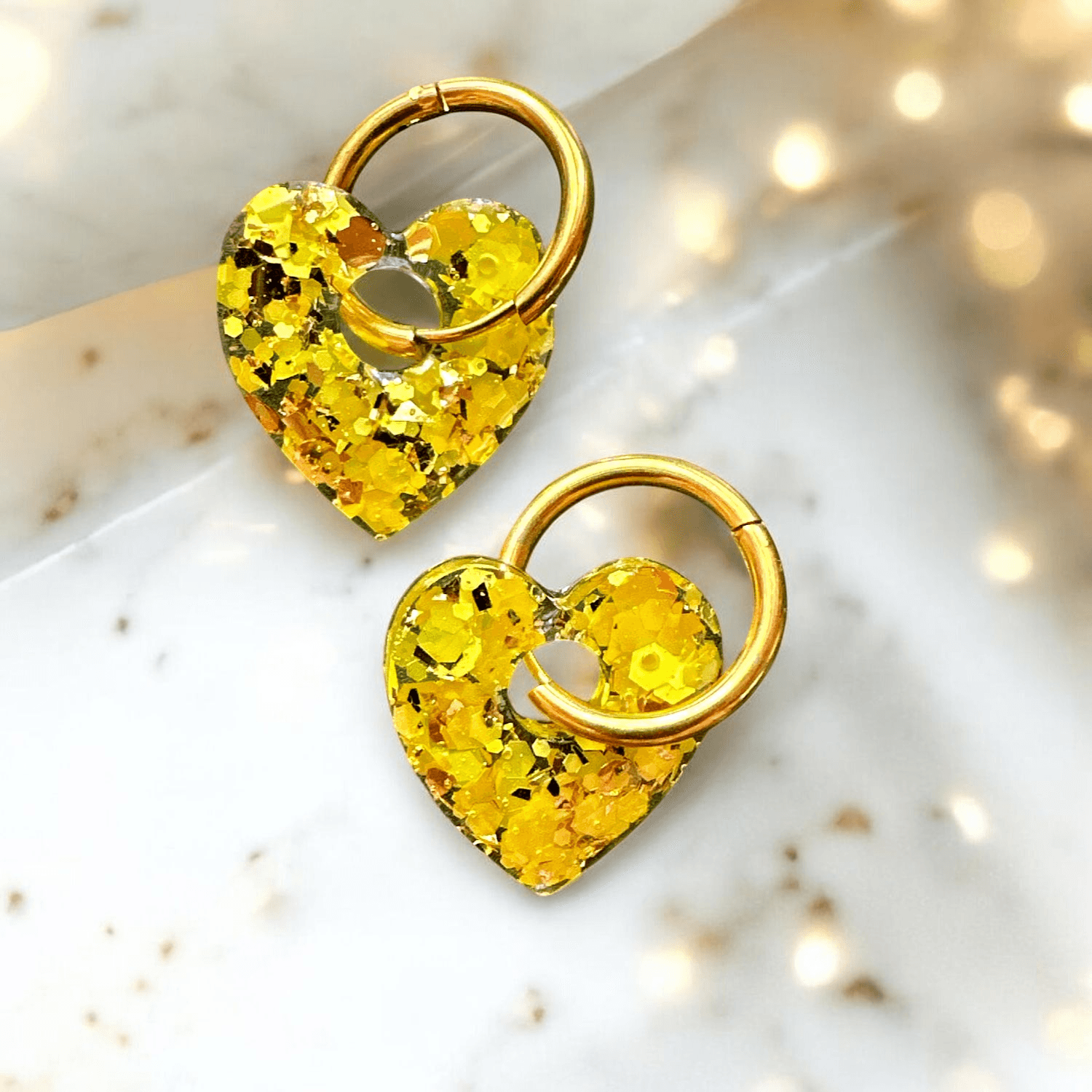 boucles d'oreilles Créoles coeur paillette jaune et or