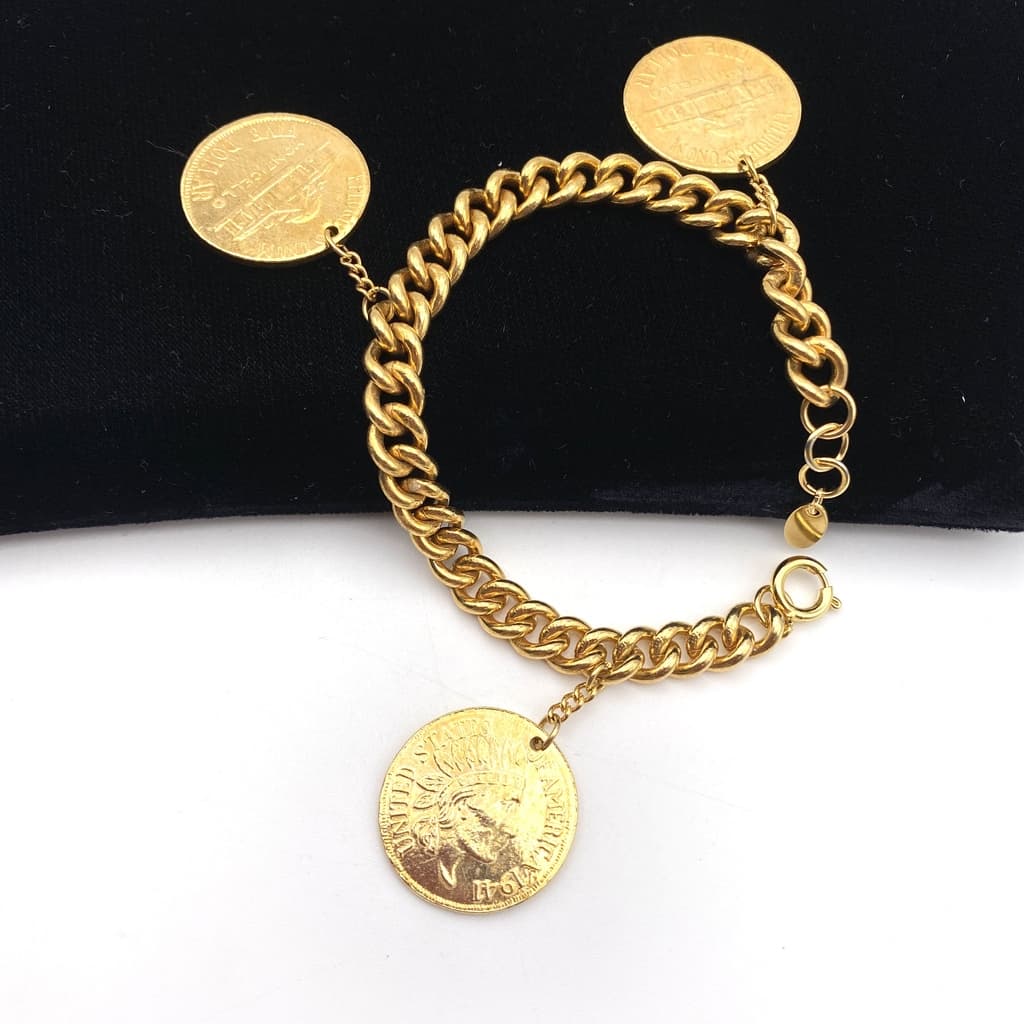 Bracelet breloques coin de 5 dollar sur gourmette