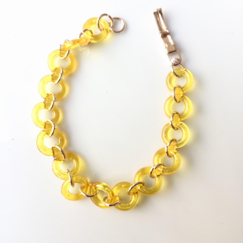 Bracelet anneaux de résine jaune et or rose