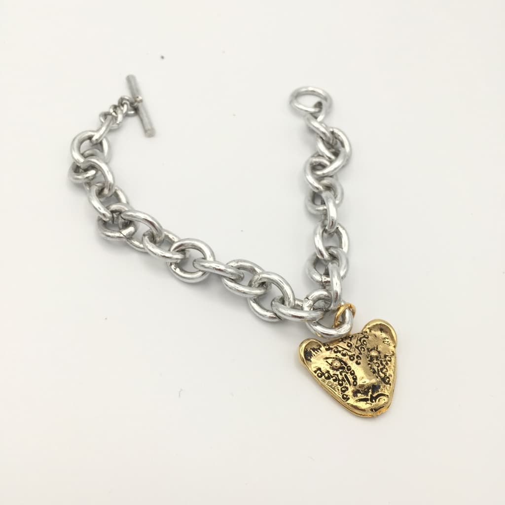 Bracelet Tigre doré pendant sur gourmette argentée