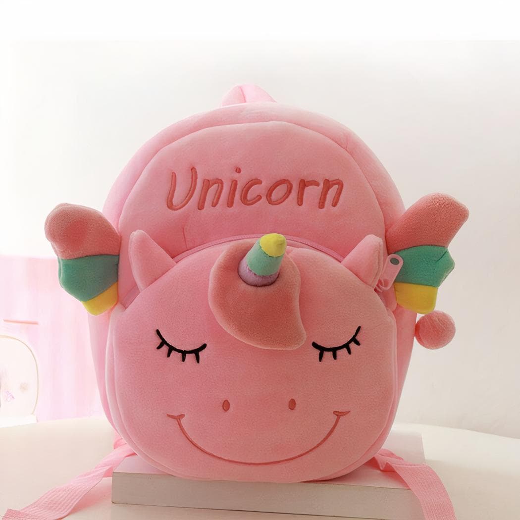 Petit sac à dos en peluche d'une licorne souriante - rose