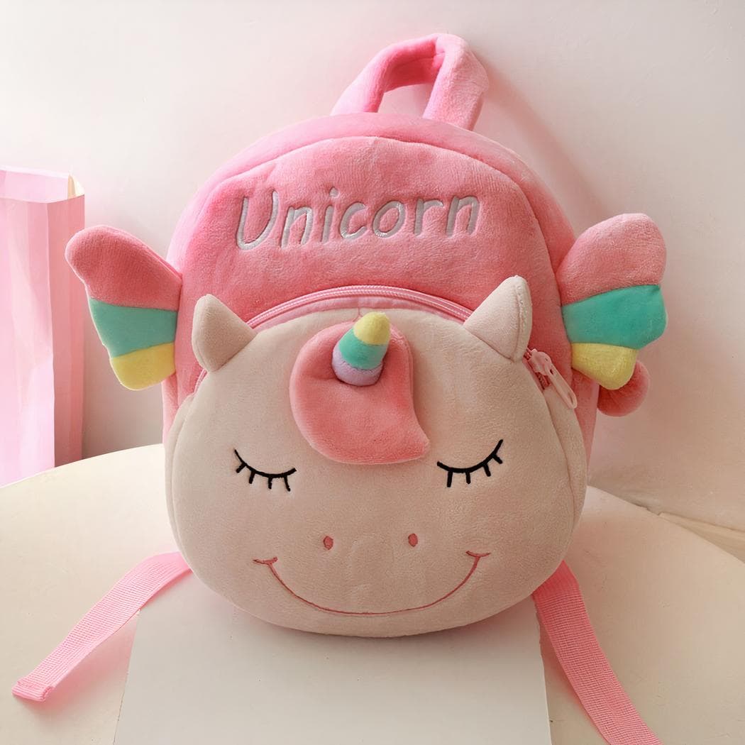 Petit sac à dos en peluche d'une licorne souriante - beige